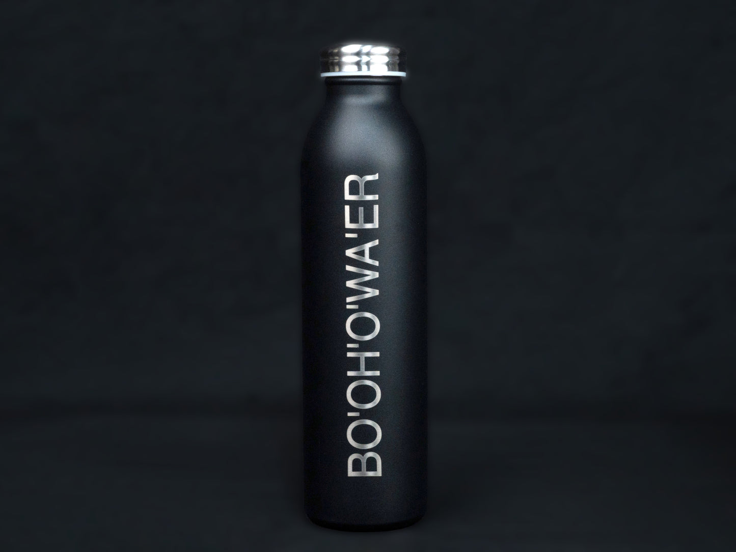 The front of the black bottle