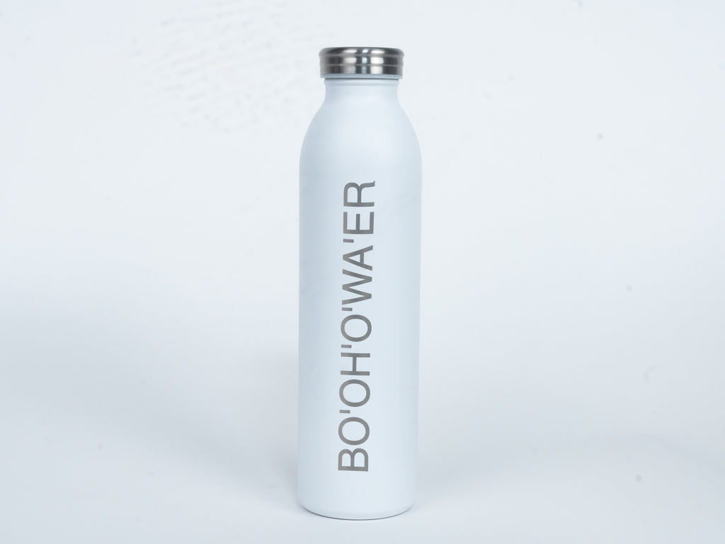 The front of the white bottle